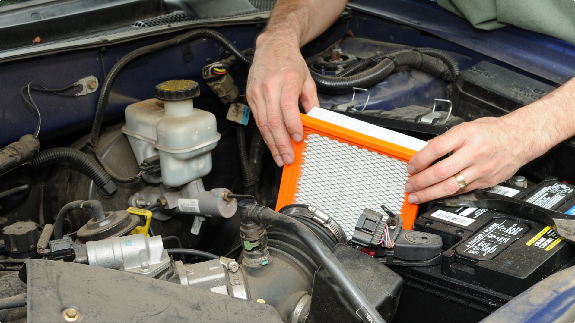 Technician Checking Vehicle Engine Air Filter