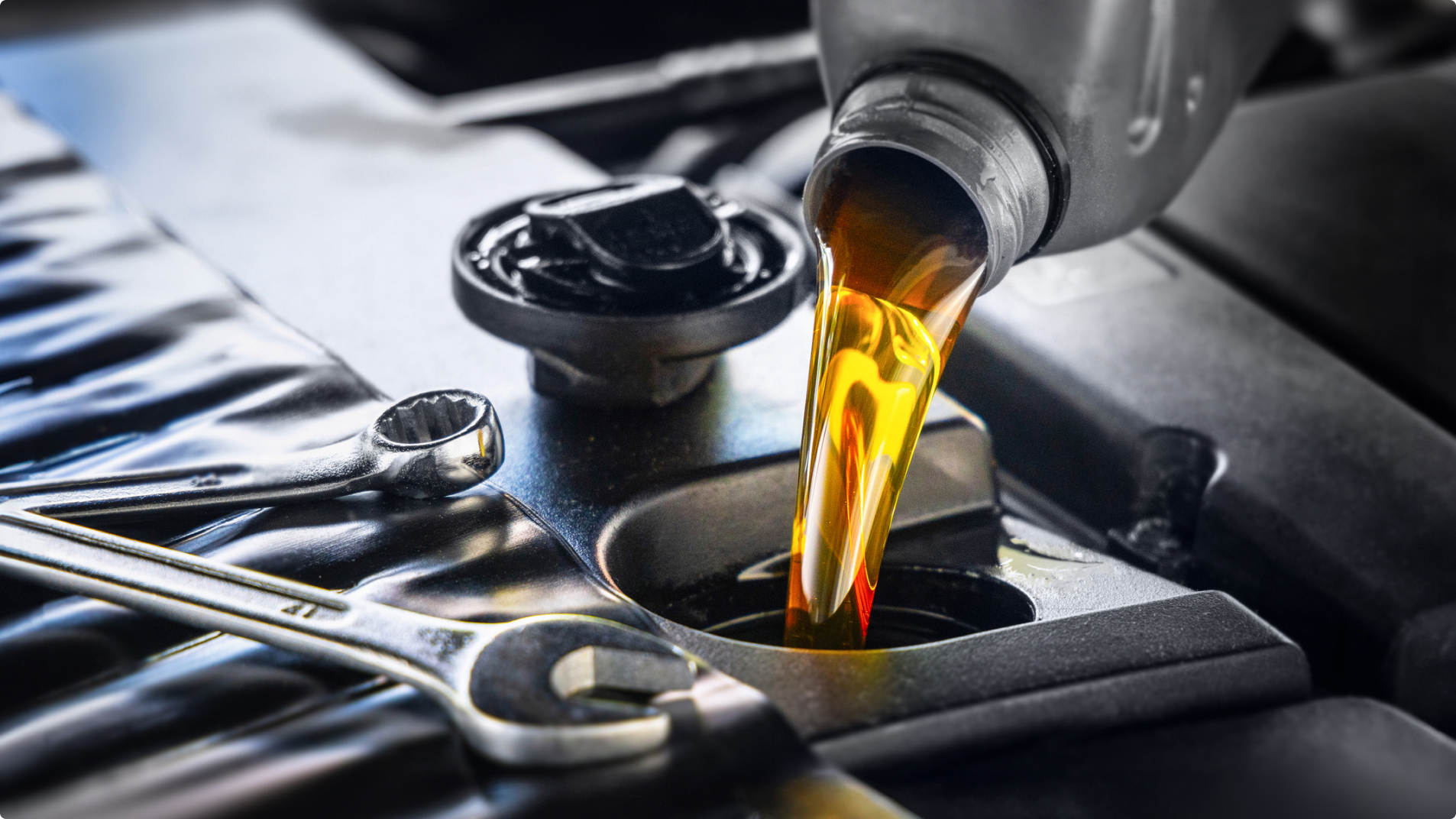 Oil Being Poured Into Vehicle Engine