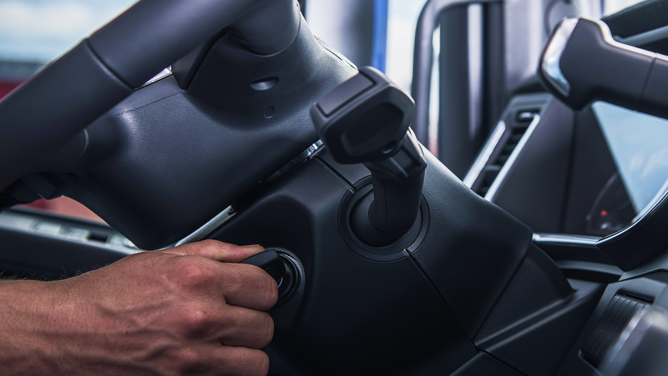 person turning key in a ignition