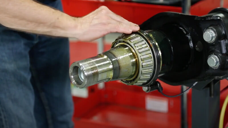 Man applying oil to the seals outline diameter