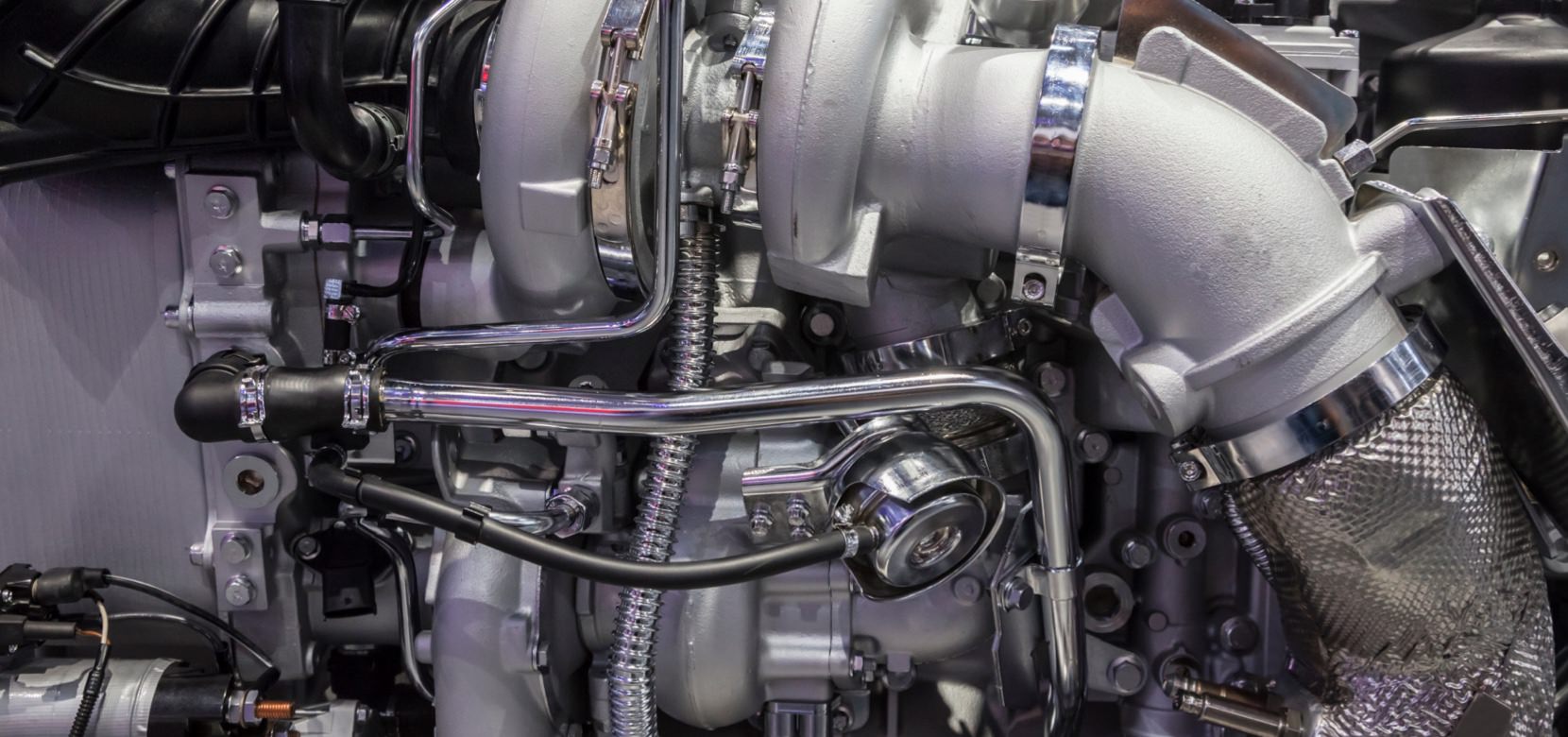 Mechanic inspecting car